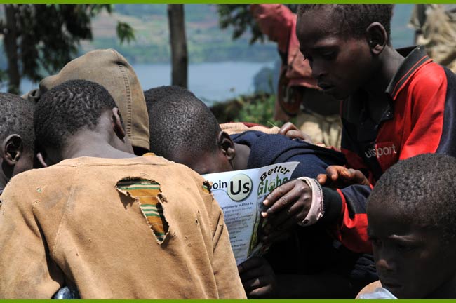 Poor Children looking at a Better Globe donation brochure