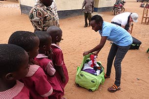 Elisabeth giving gifts to children at Mboti School, Kenya