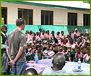 Jan Vandenabeele teaches school children how to plant trees